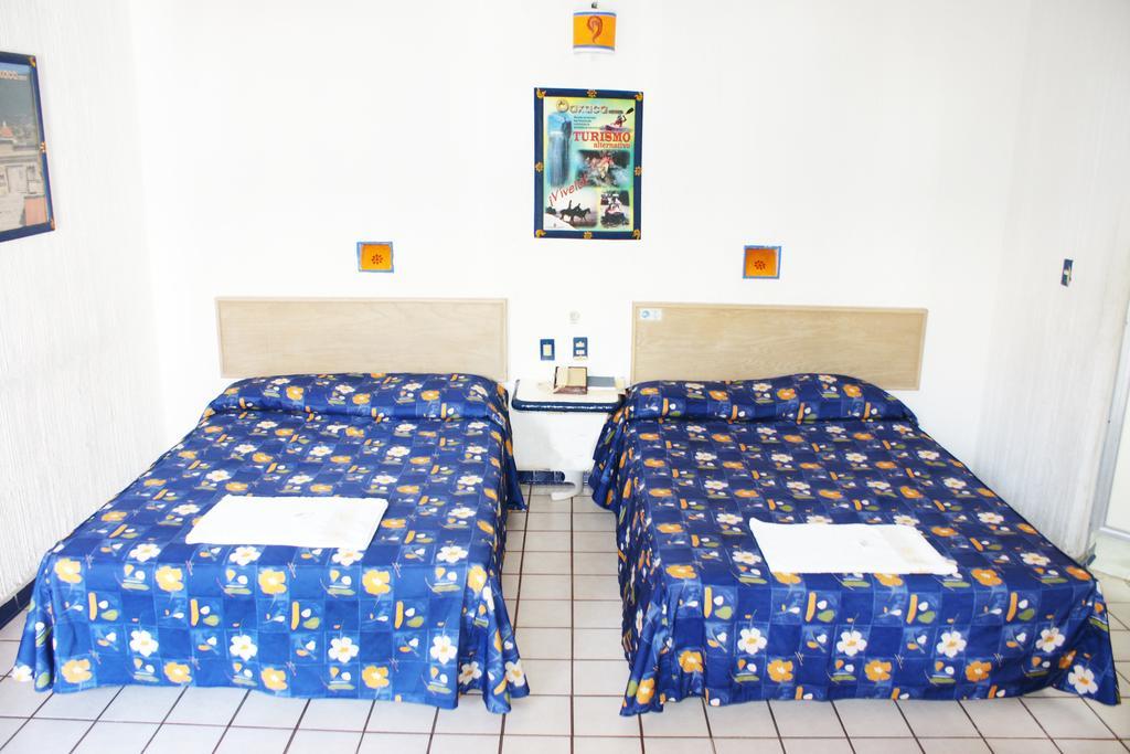 Hotel Plaza Conejo Huatulco Стая снимка